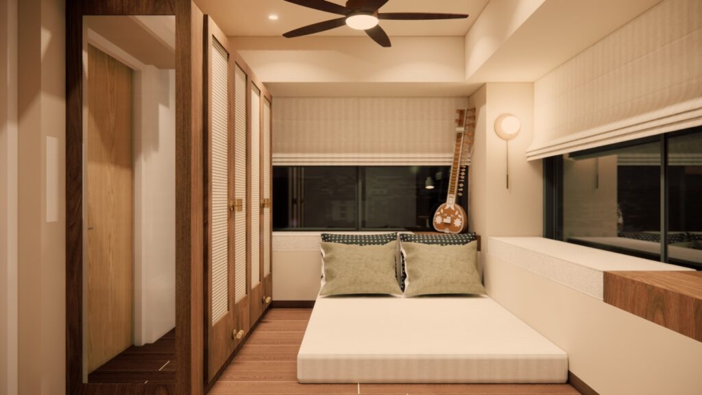 Floor-level roll-up bed, cane-mesh wardrobe panels, and a sitar resting against the window seat